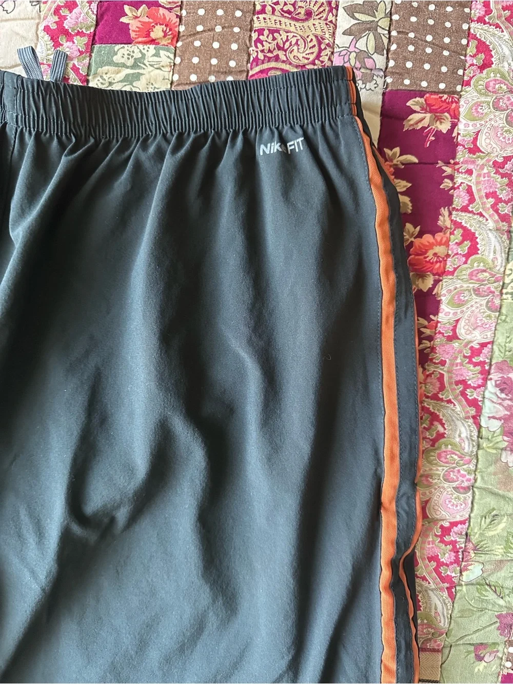 Nike Men’s Black Athletic Shorts with Orange Side Stripes